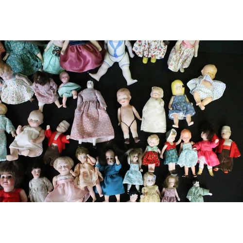 1582 - Collection of small / miniature dolls featuring antique, German, bisque and plastic examples, condit... 