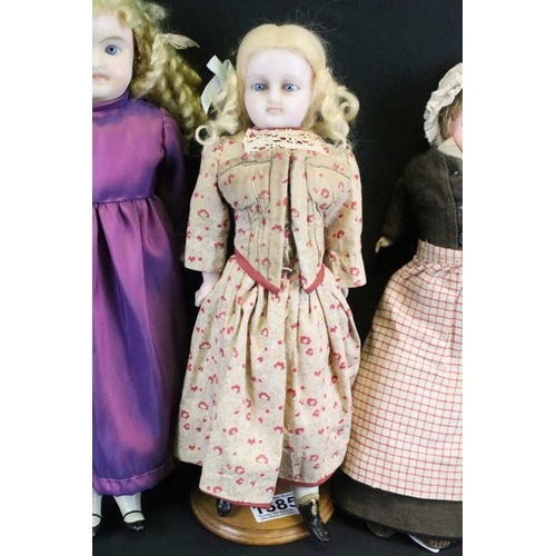 1585 - Four late 19th / early 20th century wax headed dolls with glass eyes and painted facial features, to... 