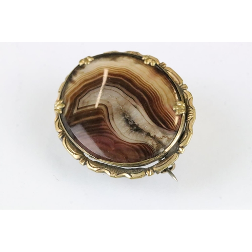 168 - Victorian yellow metal oval brooch, glazed panel verso; an early 20th century banded agate yellow me... 