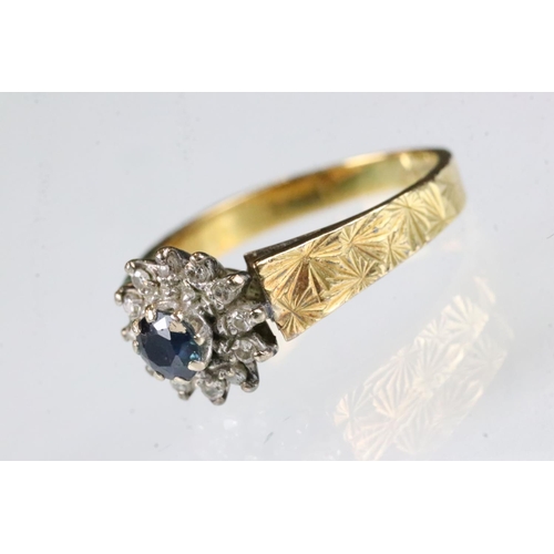 174 - Sapphire and diamond 18ct yellow gold flower head ring, round mixed cut blue sapphire, diameter appr... 