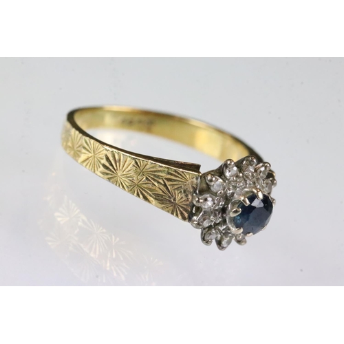 174 - Sapphire and diamond 18ct yellow gold flower head ring, round mixed cut blue sapphire, diameter appr... 