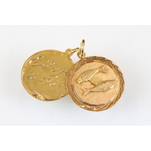 178 - 18ct gold pendant with two fish in relief, diameter approx 2cm; together with a yellow metal pendant... 