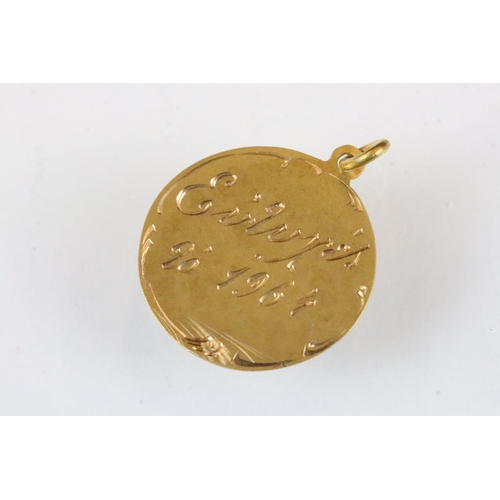 178 - 18ct gold pendant with two fish in relief, diameter approx 2cm; together with a yellow metal pendant... 