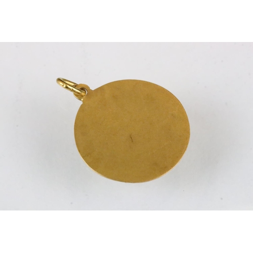 178 - 18ct gold pendant with two fish in relief, diameter approx 2cm; together with a yellow metal pendant... 