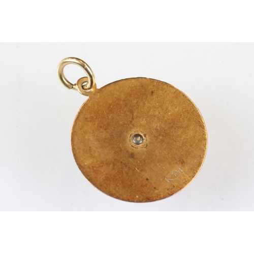 178 - 18ct gold pendant with two fish in relief, diameter approx 2cm; together with a yellow metal pendant... 