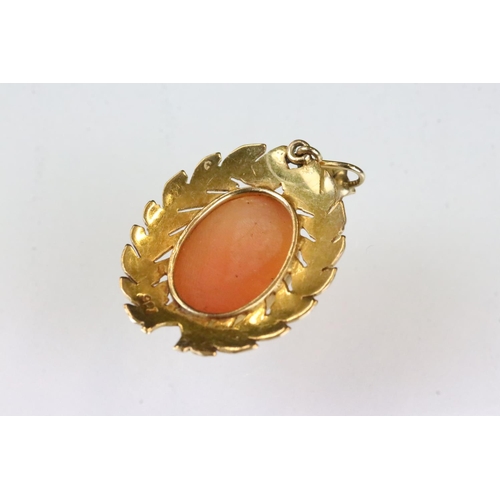 180 - Cameo 9ct yellow gold pendant, the female profile facing left, laurel leaf surround; together with a... 