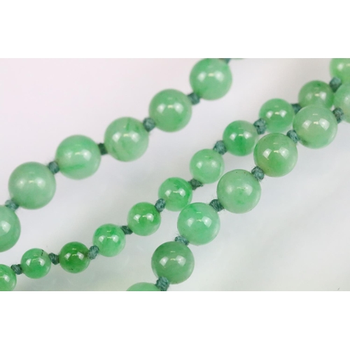 31 - Art Deco jade and diamond necklace, sixty-six graduated round jade beads, the largest diameter appro... 