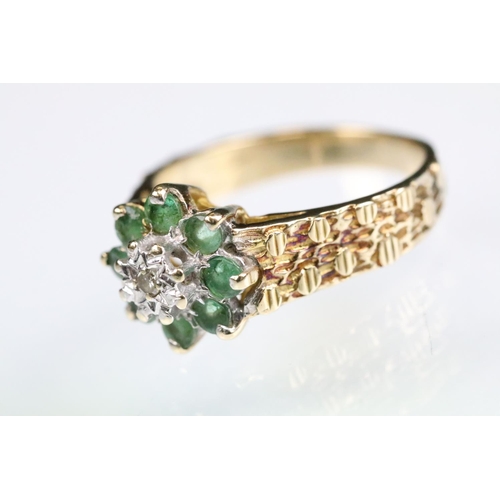 141 - Emerald and diamond 9ct yellow gold flower head cluster ring, small round eight cut diamond to the c... 