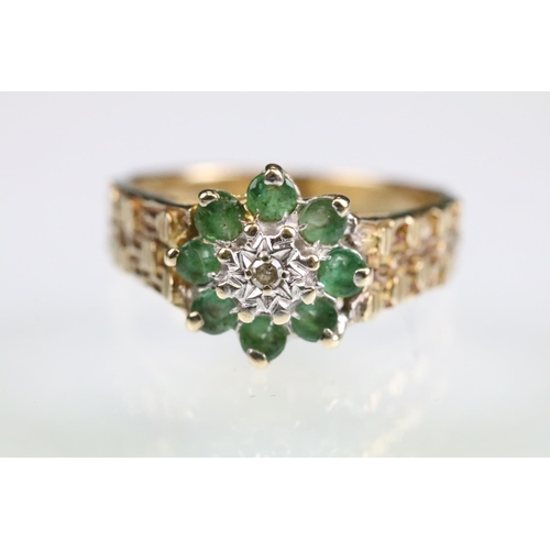 141 - Emerald and diamond 9ct yellow gold flower head cluster ring, small round eight cut diamond to the c... 