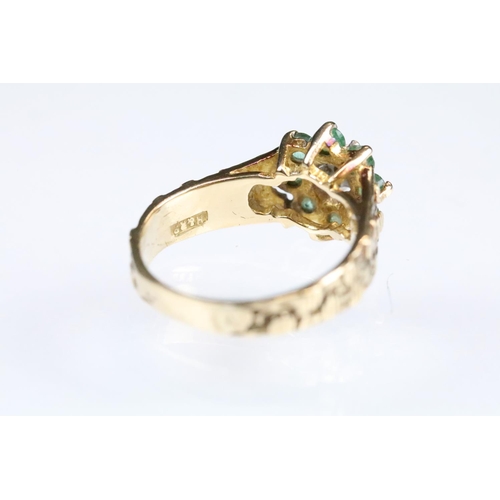 141 - Emerald and diamond 9ct yellow gold flower head cluster ring, small round eight cut diamond to the c... 