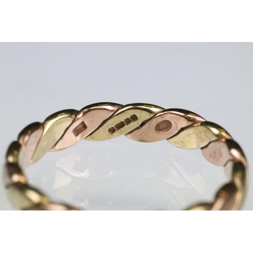 146 - 9ct yellow and rose gold interwoven ring, width approx 3.5mm, ring size Q