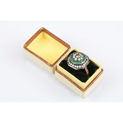 40 - Diamond and emerald rose metal ring, the central round brilliant cut diamond weighing approx 0.15 ca... 