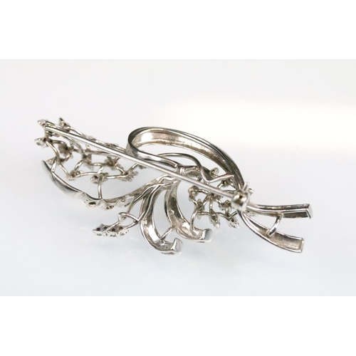 41 - Diamond white metal spray brooch, small round eight cut diamonds, textured stylised leaves, dimensio... 