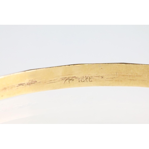 46 - 18ct yellow gold bangle, faceted design, width approx 3.5mm, interior diameter approx 20.5cm