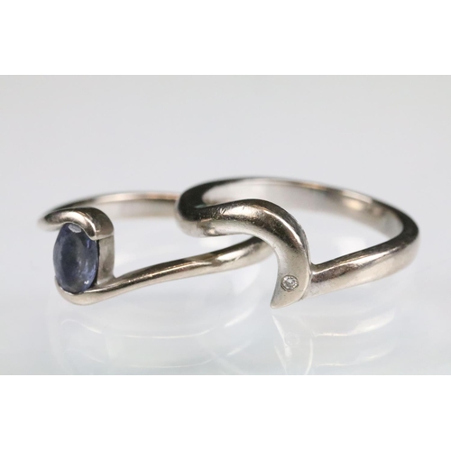 93 - Tanzanite 18ct white gold ring, the oval mixed cut tanzanite measuring approx 5.5 x 4mm, crossover s... 