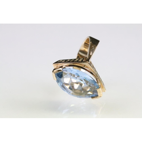 94 - Blue topaz 9ct gold ring, the marquise cut blue topaz measuring approx 18.5 x 12mm, tapered shoulder... 