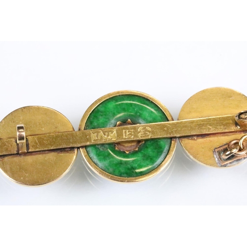 97 - Jade yellow metal bar brooch, jade disc to the centre, character mark panels either side, hinged pin... 