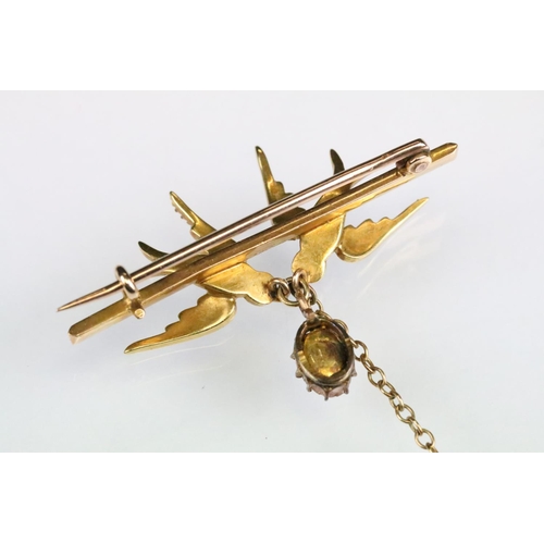 99 - Early 20th century seed pearl yellow metal brooch, modelled as two swallows, foiled rock crystal dro... 