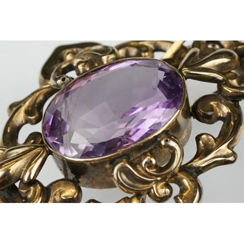 105 - Late 19th /  early 20th century amethyst yellow metal brooch, the oval mixed cut amethyst measuring ... 