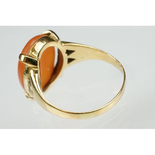 106 - Carnelian unmarked yellow gold ring, the oval cabochon cut carnelian measuring approx 13 x 10.5mm, c... 