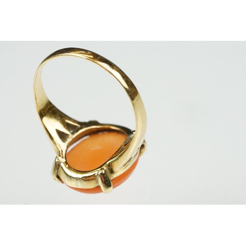 106 - Carnelian unmarked yellow gold ring, the oval cabochon cut carnelian measuring approx 13 x 10.5mm, c... 