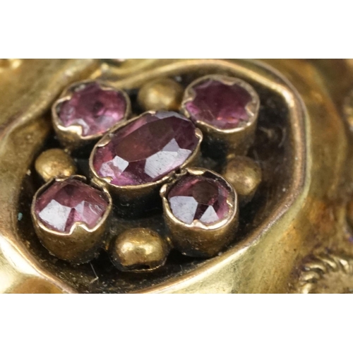 108 - Early Victorian garnet yellow metal brooch of quatrefoil form, five garnets, foil backed, rope twist... 