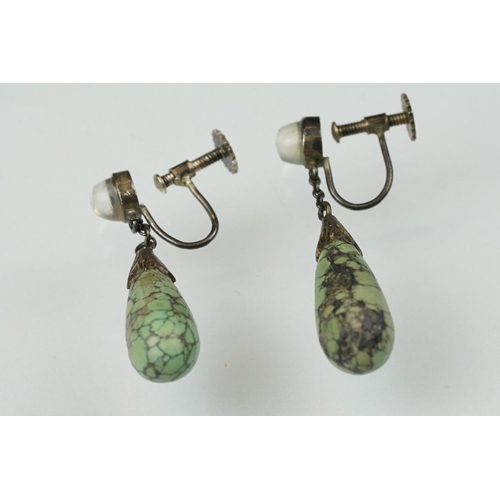 109 - Pair of early 20th century moonstone and turquoise unmarked silver screw back drop earrings, the tap... 