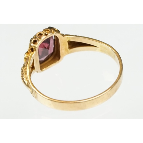 18 - Victorian garnet and emerald 15ct yellow gold ring, the oval mixed cut garnet measuring approx 7x 6m... 