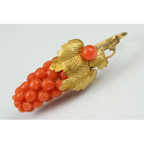 23 - Pair of 19th century carved coral yellow metal earrings, the coral carved as grapes, cast vine leave... 