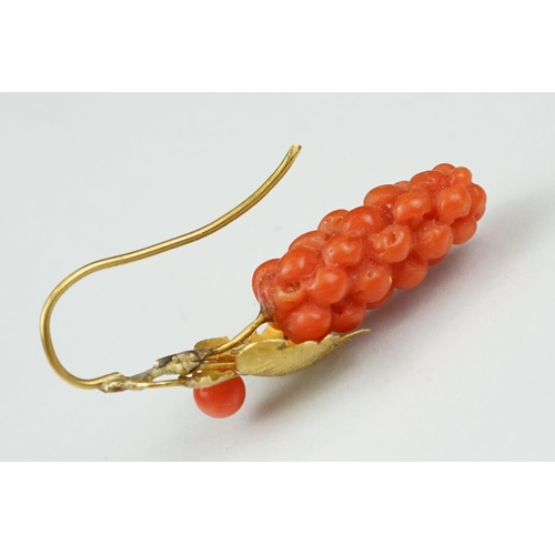 23 - Pair of 19th century carved coral yellow metal earrings, the coral carved as grapes, cast vine leave... 