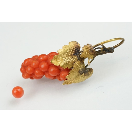 23 - Pair of 19th century carved coral yellow metal earrings, the coral carved as grapes, cast vine leave... 