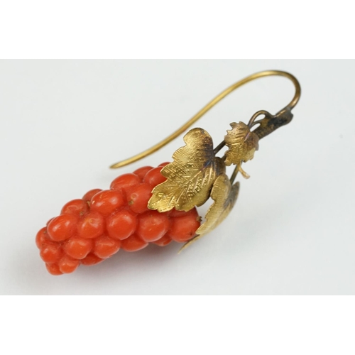 23 - Pair of 19th century carved coral yellow metal earrings, the coral carved as grapes, cast vine leave... 