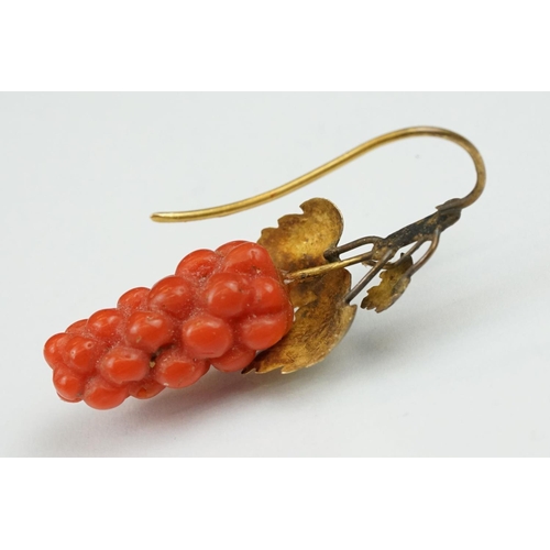 23 - Pair of 19th century carved coral yellow metal earrings, the coral carved as grapes, cast vine leave... 