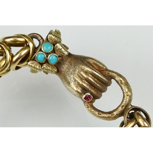 25 - 19th century garnet and turquoise yellow metal bracelet, the clasp modelled as a hand holding a coil... 