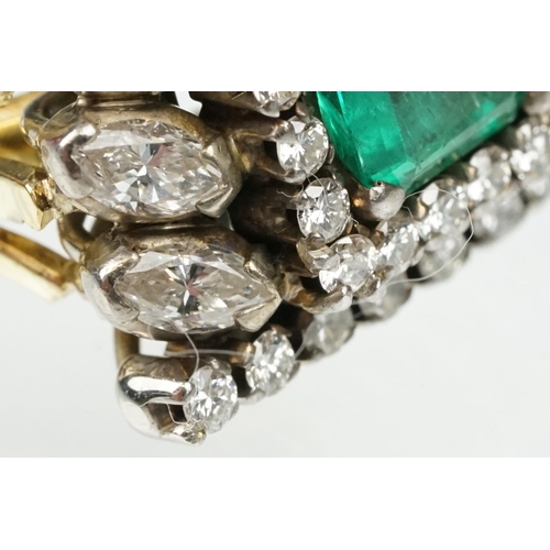 29 - Emerald and diamond 18ct yellow and white gold cluster ring, the central emerald cut emerald measuri... 