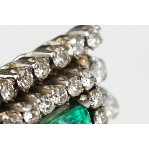 29 - Emerald and diamond 18ct yellow and white gold cluster ring, the central emerald cut emerald measuri... 