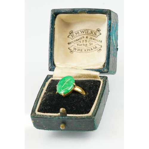 9 - Imperial jade yellow gold ring, the oval cabochon cut jade measuring approx 14.5 x 10.5mm, claw set,... 