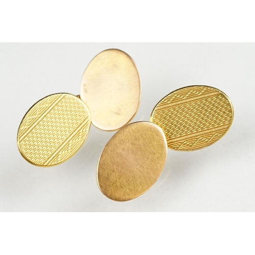 123 - Pair of 9ct and 18ct yellow gold chain link panel cufflinks, each with a plain oval 9ct gold panel a... 