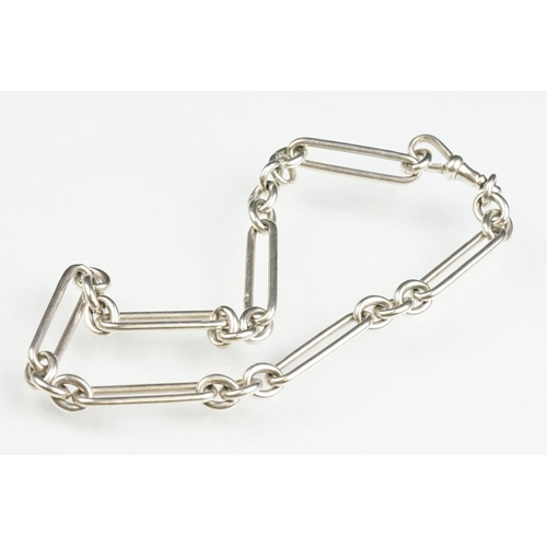 140 - Silver trombone link watch chain, each link hallmarked, silver dog clip, length approx 35cm; white m... 