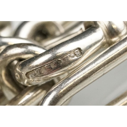 140 - Silver trombone link watch chain, each link hallmarked, silver dog clip, length approx 35cm; white m... 