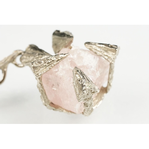 54 - Brutalist rose quartz unmarked silver pendant necklace, the rough rose quart with abstract triangula... 