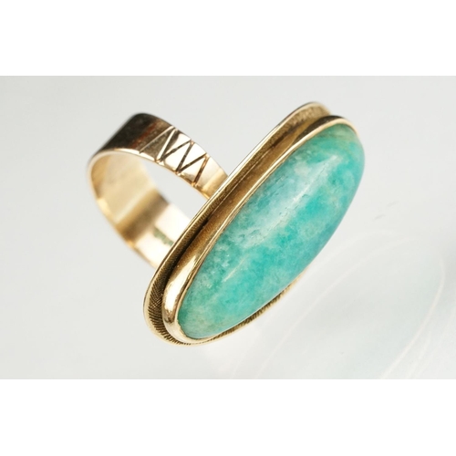 55 - Green hardstone 9ct yellow gold ring, the elongated oval cabochon possibly aventurine quartz, rubove... 