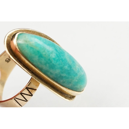 55 - Green hardstone 9ct yellow gold ring, the elongated oval cabochon possibly aventurine quartz, rubove... 