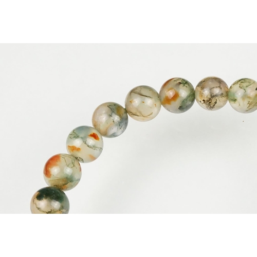 59 - Moss agate bead necklace, sixty-two graduated moss agate beads, the largest measuring approx 17mm, t... 