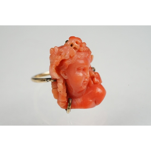 60 - 19th century coral 9ct yellow gold ring, the carved coral depicting a female head with grapes and vi... 