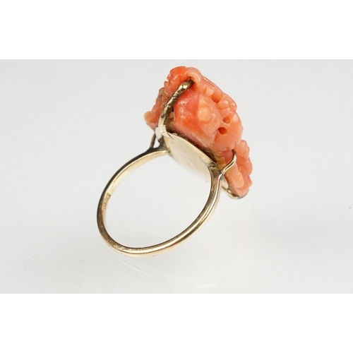 60 - 19th century coral 9ct yellow gold ring, the carved coral depicting a female head with grapes and vi... 