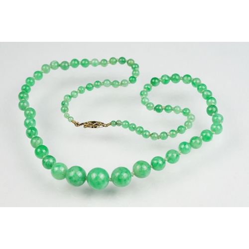 62 - Jade 9ct yellow gold bead necklace, seventy-seven graduated circular beads, the largest diameter app... 