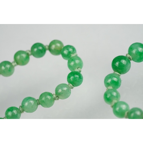 62 - Jade 9ct yellow gold bead necklace, seventy-seven graduated circular beads, the largest diameter app... 