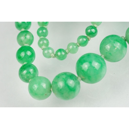 62 - Jade 9ct yellow gold bead necklace, seventy-seven graduated circular beads, the largest diameter app... 