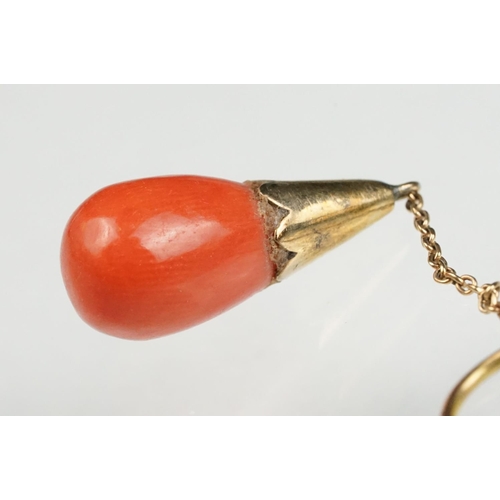 65 - Pair of early 20th century coral 9ct yellow gold drop earrings, the tapered coral with conical yello... 